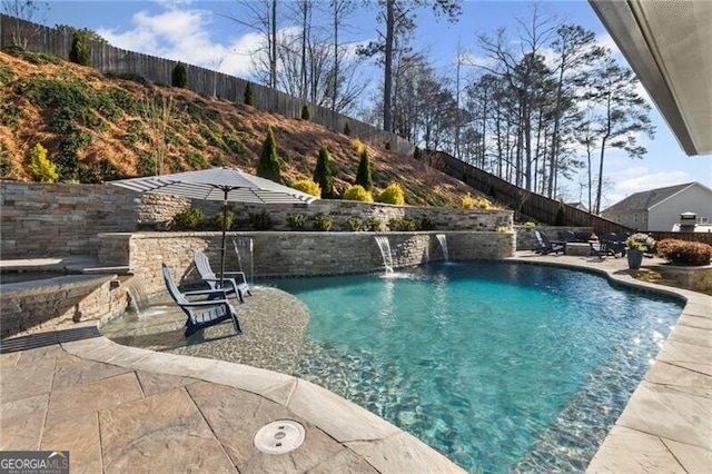 view of pool with a patio, a fenced in pool, and a fenced backyard