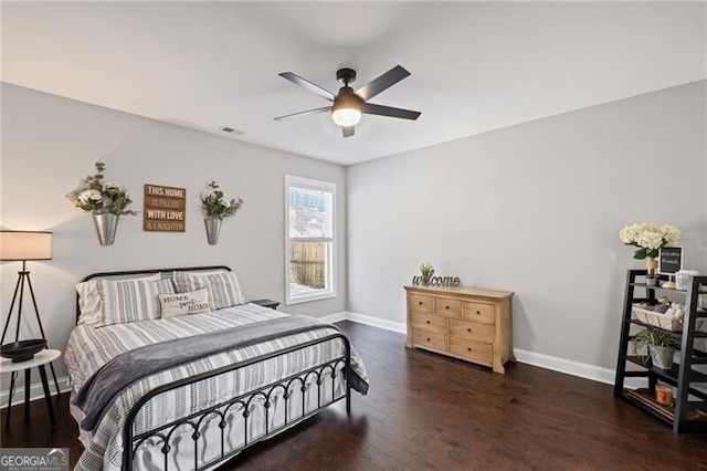 bedroom with wood finished floors, baseboards, ceiling fan, and visible vents