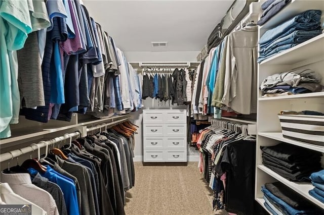 walk in closet with carpet and visible vents