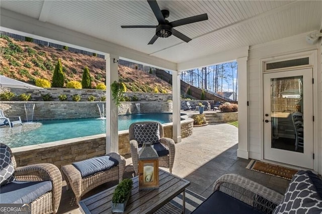 view of patio with ceiling fan and a fenced in pool