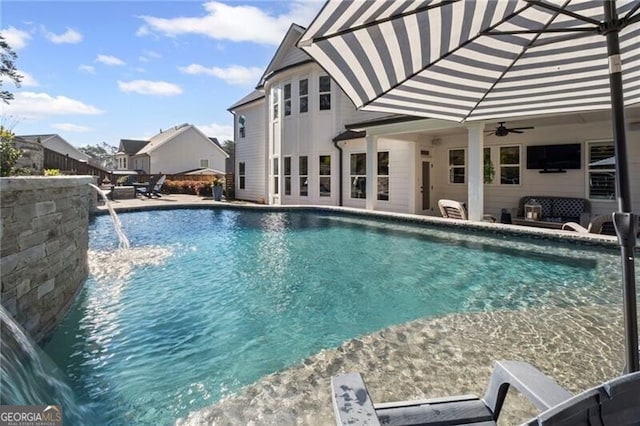pool featuring ceiling fan and a patio