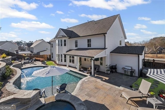 view of swimming pool with a fenced backyard, a fenced in pool, an outdoor hot tub, and a patio area
