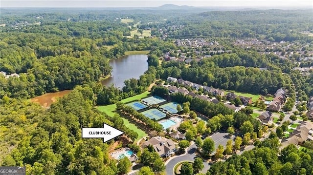 aerial view with a water view and a view of trees