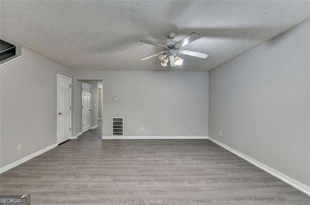 2892 Norfair Loop NE, Lithonia, GA 30038 - empty room featuring wood finished floors, visible vents, a textured ceiling, and ceiling fan