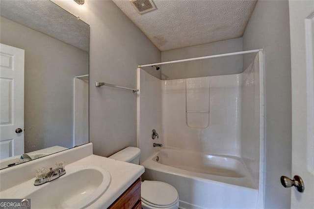 2892 Norfair Loop NE, Lithonia, GA 30038 - full bath featuring vanity, toilet, a textured ceiling, visible vents, and washtub / shower combination