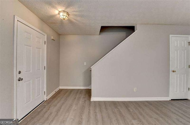 2892 Norfair Loop NE, Lithonia, GA 30038 - entrance foyer with a textured ceiling, baseboards, and wood finished floors