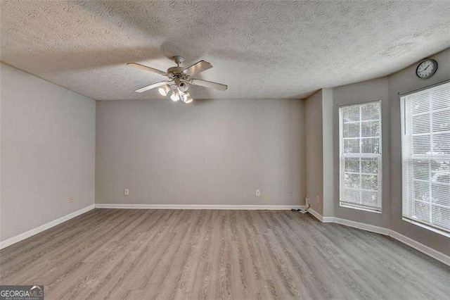 2892 Norfair Loop NE, Lithonia, GA 30038 - unfurnished room featuring a ceiling fan, baseboards, and wood finished floors
