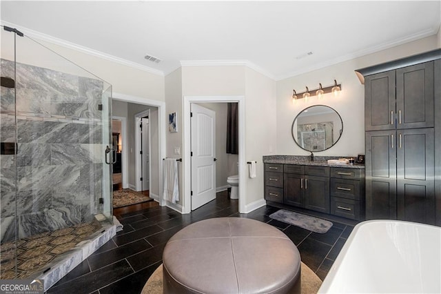 full bath featuring a shower stall, vanity, toilet, ornamental molding, and visible vents