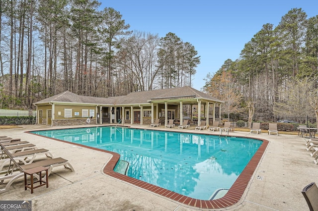 2290 Dragonfly Ct, Acworth, GA 30101 - community pool with a patio area and view of wooded area