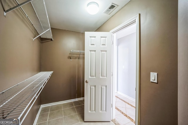 spacious closet featuring tile patterned floors and visible vents