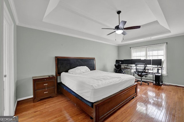 7037 Waters Edge Dr, Stone Mountain, GA 30087 - bedroom with a tray ceiling, crown molding, light wood finished floors, and baseboards