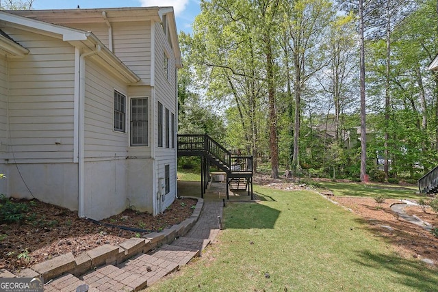 7037 Waters Edge Dr, Stone Mountain, GA 30087 - view of yard with a deck and stairs