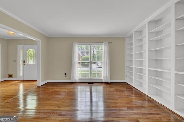 7037 Waters Edge Dr, Stone Mountain, GA 30087 - interior space featuring baseboards, ornamental molding, and wood finished floors