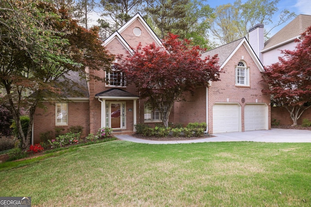 traditional home with brick siding, a front lawn, a garage, and driveway