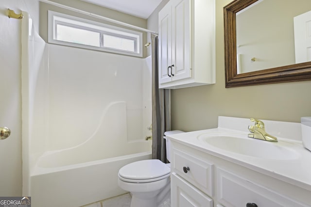 bathroom featuring toilet, shower / tub combo, and vanity