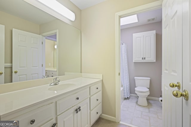 bathroom featuring toilet, vanity, baseboards, and visible vents
