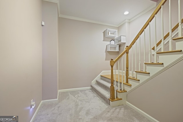 staircase with carpet flooring, baseboards, and crown molding