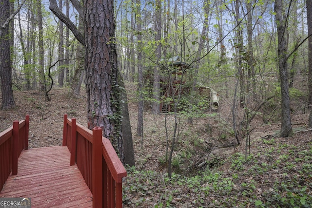exterior space featuring a forest view