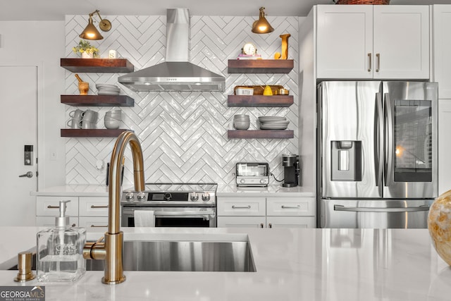 kitchen featuring ventilation hood, tasteful backsplash, stainless steel appliances, and open shelves