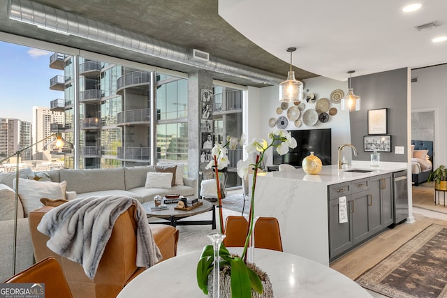 dining room with beverage cooler, light wood-style flooring, a view of city, visible vents, and floor to ceiling windows