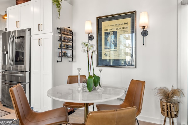 dining space featuring baseboards
