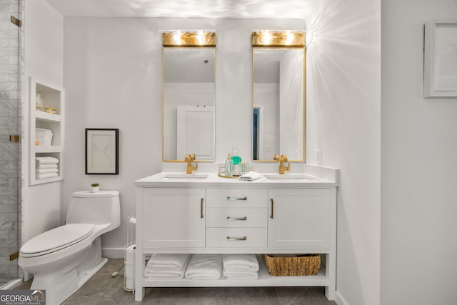 bathroom featuring baseboards, toilet, double vanity, and a sink