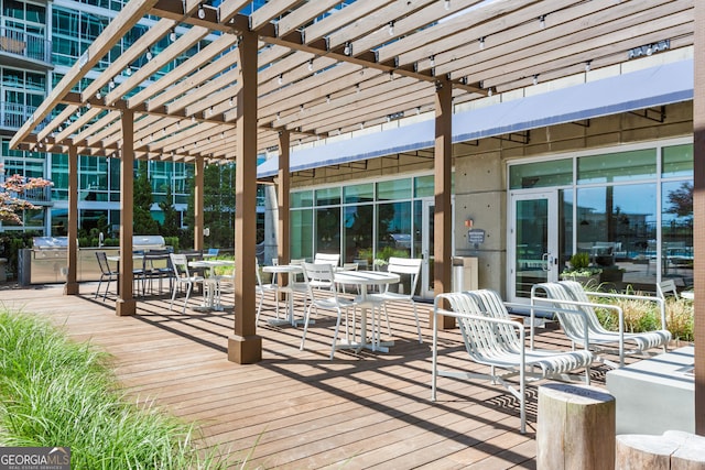 view of patio / terrace with outdoor dining space and a pergola