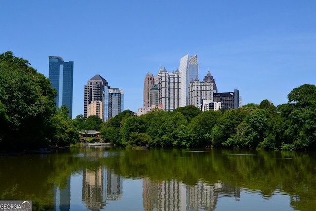 property's view of city featuring a water view