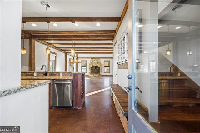 1759 Moccasin Gap Rd, Lula, GA 30554 - kitchen featuring stainless steel dishwasher, beam ceiling, finished concrete flooring, light stone counters, and pendant lighting