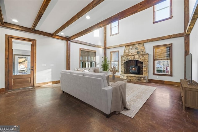 1759 Moccasin Gap Rd, Lula, GA 30554 - living area with healthy amount of natural light, beamed ceiling, baseboards, recessed lighting, and a fireplace