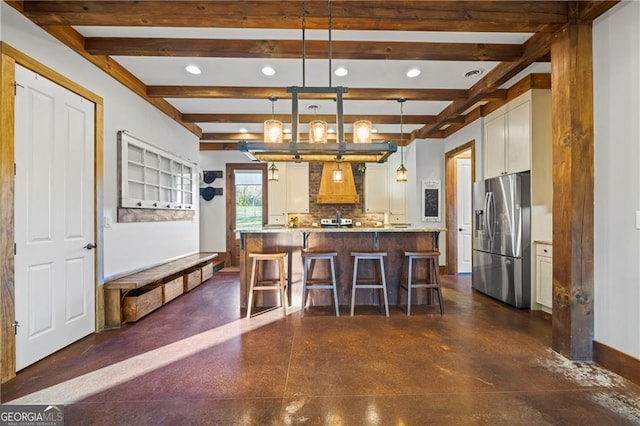 1759 Moccasin Gap Rd, Lula, GA 30554 - kitchen with stainless steel refrigerator with ice dispenser, recessed lighting, a kitchen bar, baseboards, and tasteful backsplash