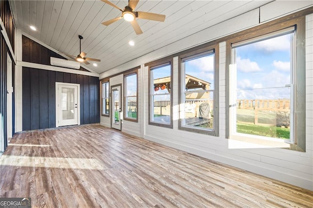 1759 Moccasin Gap Rd, Lula, GA 30554 - unfurnished sunroom featuring wood finished floors, wood walls, vaulted ceiling, a wall mounted air conditioner, and wood ceiling
