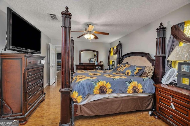104 Sugar Maple Way, Kingsland, GA 31548 - bedroom with a textured ceiling, ceiling fan, and wood finished floors