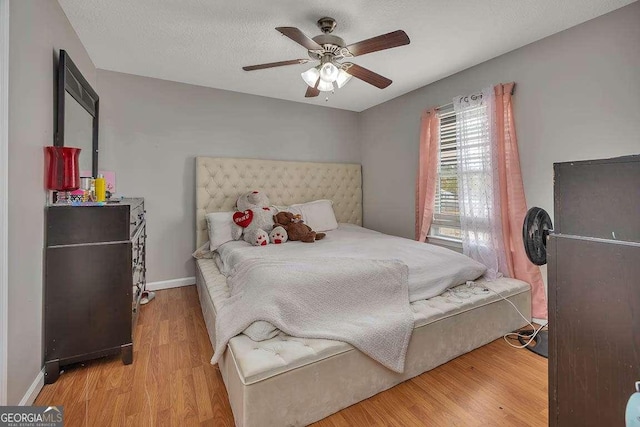 104 Sugar Maple Way, Kingsland, GA 31548 - bedroom featuring wood finished floors, a ceiling fan, and baseboards