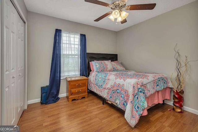 104 Sugar Maple Way, Kingsland, GA 31548 - bedroom featuring a closet, wood finished floors, baseboards, and a ceiling fan