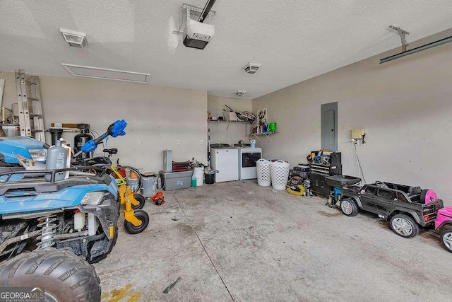 104 Sugar Maple Way, Kingsland, GA 31548 - garage featuring washer and clothes dryer, electric panel, and a garage door opener