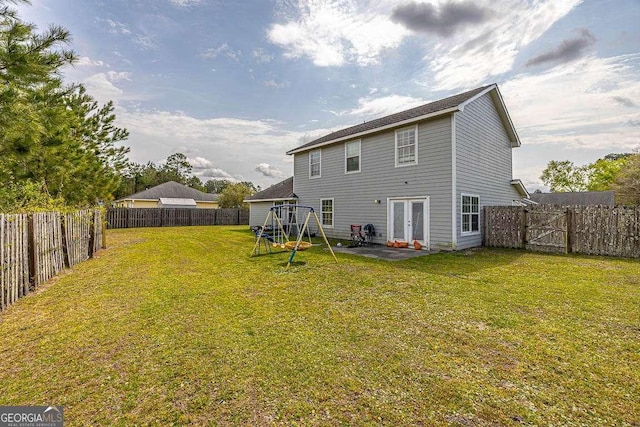 104 Sugar Maple Way, Kingsland, GA 31548 - back of house with a playground, a patio, and french doors