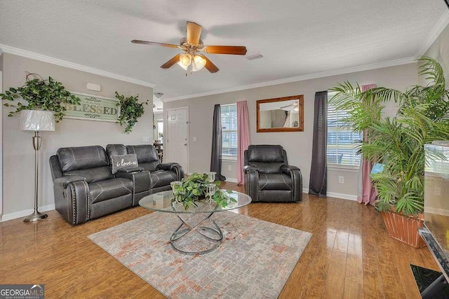 104 Sugar Maple Way, Kingsland, GA 31548 - living area featuring healthy amount of natural light, a ceiling fan, wood finished floors, baseboards, and crown molding