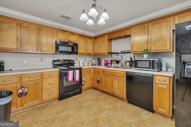 104 Sugar Maple Way, Kingsland, GA 31548 - kitchen featuring black appliances, a sink, a chandelier, crown molding, and light countertops