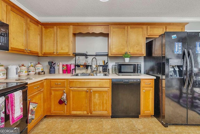 104 Sugar Maple Way, Kingsland, GA 31548 - kitchen featuring black appliances, crown molding, light countertops, a textured ceiling, and brown cabinetry