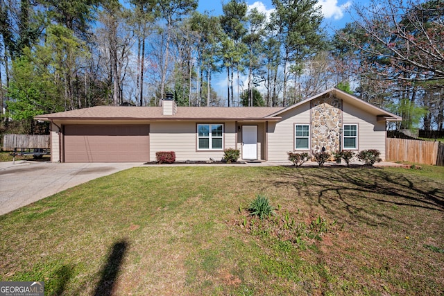 single story home with a chimney, fence, an attached garage, driveway, and a front yard