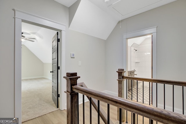 898 Bowdon Junction Rd, Carrollton, GA 30117 - corridor with an upstairs landing, attic access, lofted ceiling, light wood finished floors, and baseboards