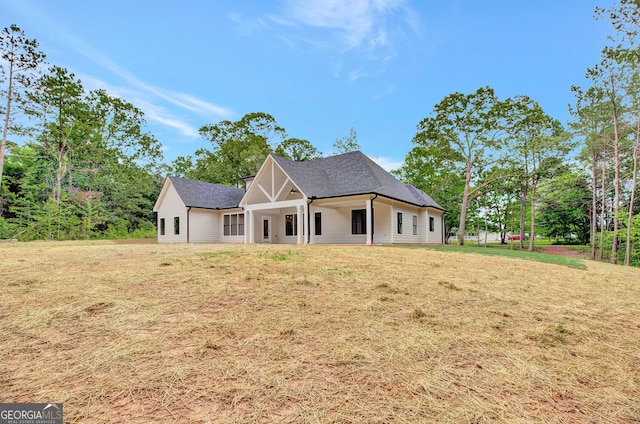 898 Bowdon Junction Rd, Carrollton, GA 30117 - view of front facade featuring a front yard and a shingled roof