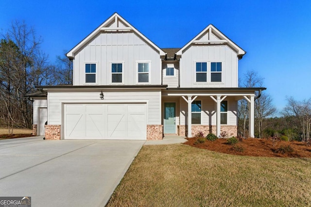 view of front facade with driveway, an attached garage, brick siding, board and batten siding, and a front lawn