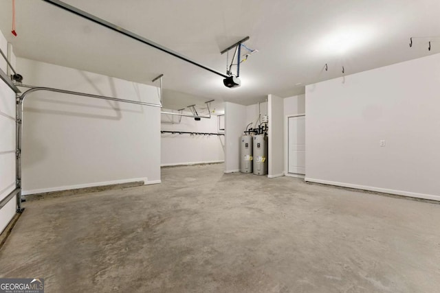 garage featuring a garage door opener, electric water heater, and baseboards