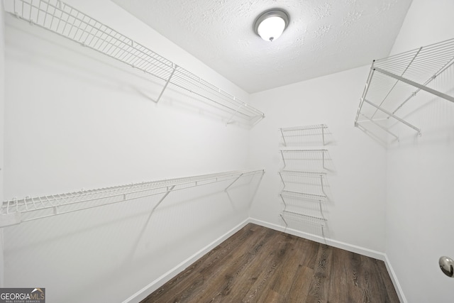 112 Bentley Pl, Tucker, GA 30084 - walk in closet featuring dark wood-type flooring