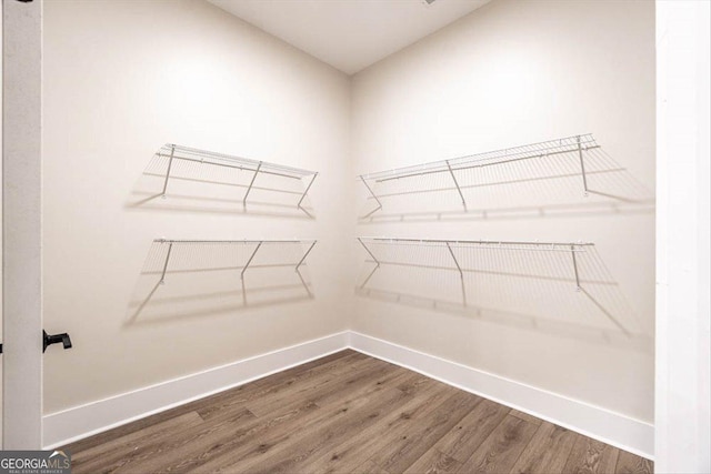 502 Camp Lake Rd, Monroe, GA 30655 - spacious closet featuring wood finished floors