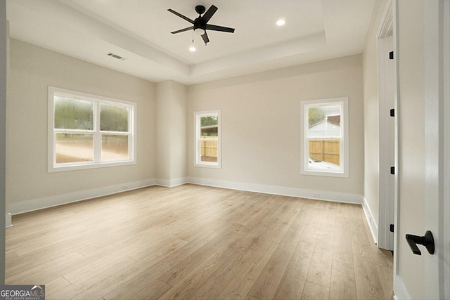 502 Camp Lake Rd, Monroe, GA 30655 - unfurnished room with healthy amount of natural light, light wood finished floors, a raised ceiling, ceiling fan, and recessed lighting