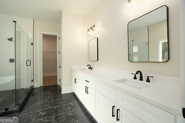 502 Camp Lake Rd, Monroe, GA 30655 - bathroom featuring marble finish floors, double vanity, a shower stall, and baseboards