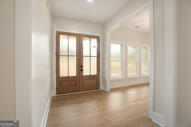 502 Camp Lake Rd, Monroe, GA 30655 - foyer with french doors, wood finished floors, and baseboards